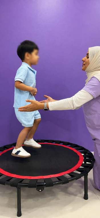Sensory gym with platform swing, climbing wall and monkey bars at Starwalkers Clinic in Dubai Healthcare City